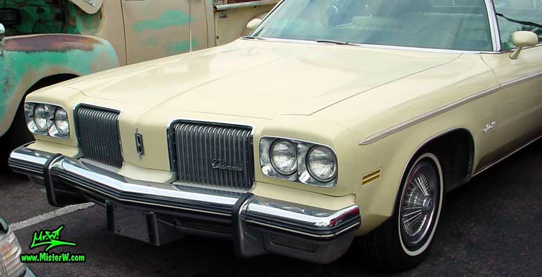 Photo of a beige 1974 Oldsmobile Royale 2 Door Convertible at the Scottsdale Pavilions Classic Car Show in Arizona. 74 Olds