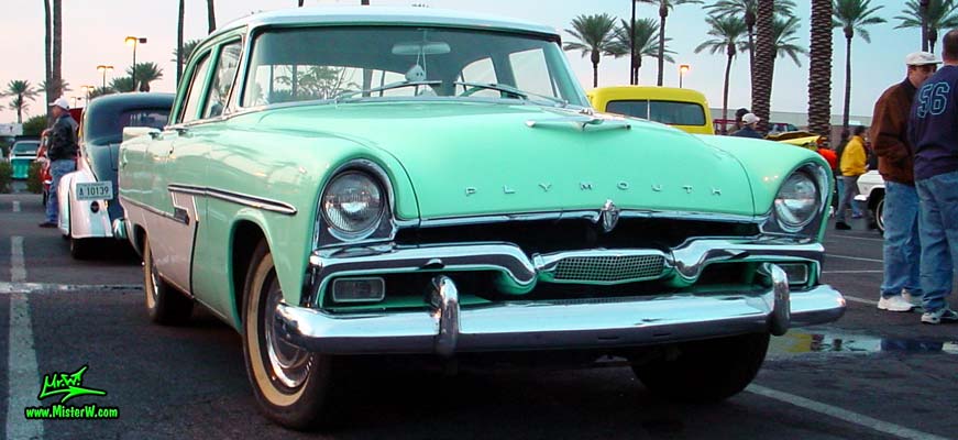 Photo of a white & turquoise 1956 Chrysler Plymouth Belvedere 4 Door Sedan at the Scottsdale Pavilions Classic Car Show in Arizona. 1956 Plymouth Belvedere