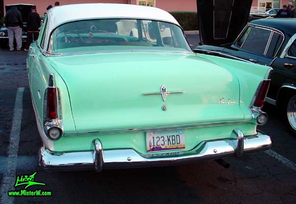 Photo of a white & turquoise 1956 Chrysler Plymouth Belvedere 4 Door Sedan at the Scottsdale Pavilions Classic Car Show in Arizona. Tail Fins of a 56 Plymouth Belvedere