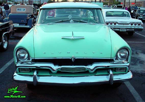 Photo of a white & turquoise 1956 Chrysler Plymouth Belvedere 4 Door Sedan at the Scottsdale Pavilions Classic Car Show in Arizona. Front Chrome Grill of a 56 Plymouth