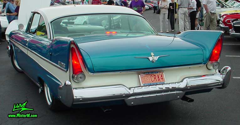 Photo of a turquoise 1957 Chrysler Plymouth Belvedere 2 Door Hardtop Coupe at the Scottsdale Pavilions Classic Car Show in Arizona. Tail Fins of a 1957 Plymouth Belvedere Coupe