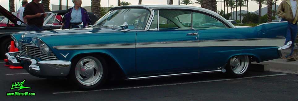 Photo of a turquoise 1957 Chrysler Plymouth Belvedere 2 Door Hardtop Coupe at the Scottsdale Pavilions Classic Car Show in Arizona. Frontview of a 1957 Plymouth Belvedere Coupe