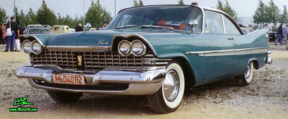 Photo of a turquoise 1959 Chrysler Plymouth Belvedere 2 Door Hardtop Coupe at a classic car meeting in Germany. Turquoise 1959 Plymouth Belvedere Coupe