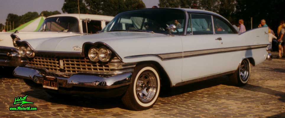 Photo of a bright blue 1959 Chrysler Plymouth Fury 2 Door Hardtop Coupe at a classic car meeting in Germany. 1959 Plymouth Fury