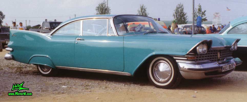 Photo of a turquoise 1959 Chrysler Plymouth Fury 2 Door Hardtop Coupe at a classic car meeting in Germany. 1959 Plymouth Fury Coupe with Fender Skirts