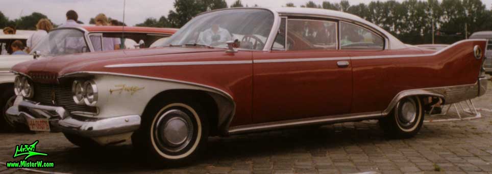 Photo of a dark red 1960 Chrysler Plymouth Fury 2 Door Hardtop Coupe at a classic car meeting in Germany. 1960 Plymouth Fury Coupe