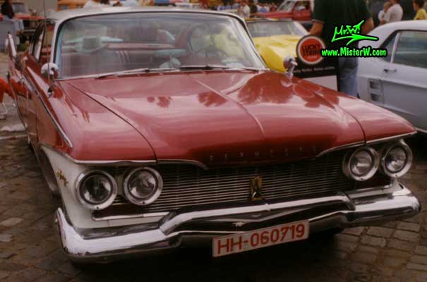 Photo of a dark red 1960 Chrysler Plymouth Fury 2 Door Hardtop Coupe at a classic car meeting in Germany. 1960 Plymouth Fury Frontview