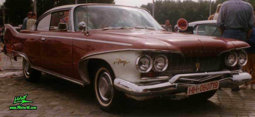 Photo of a dark red 1960 Chrysler Plymouth Fury 2 Door Hardtop Coupe at a classic car meeting in Germany. 1960 Plymouth