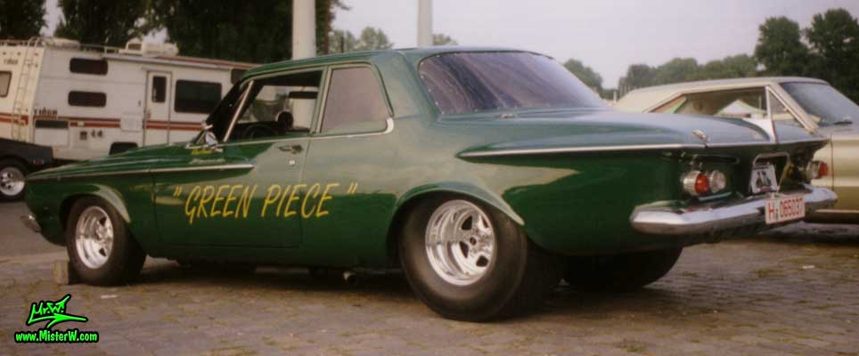 Photo of a dark green 1962 Chrysler Plymouth 2 Door Hardtop Coupe at a classic car meeting in Germany. 1962 Plymouth Coupe - Green Piece