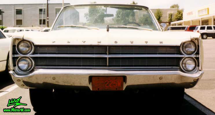 Photo of a white 1967 Chrysler Plymouth Sport Fury Convertible in Sunnyslope, Arizona. Chrome Grill of a 1967 Plymouth Sport Fury Convertible