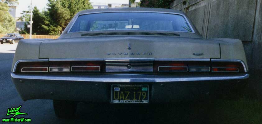 Photo of a gold brown 1967 Chrysler Plymouth 2 Door Hardtop Coupe in San Francisco, California. Back of a 1967 Plymouth Coupe