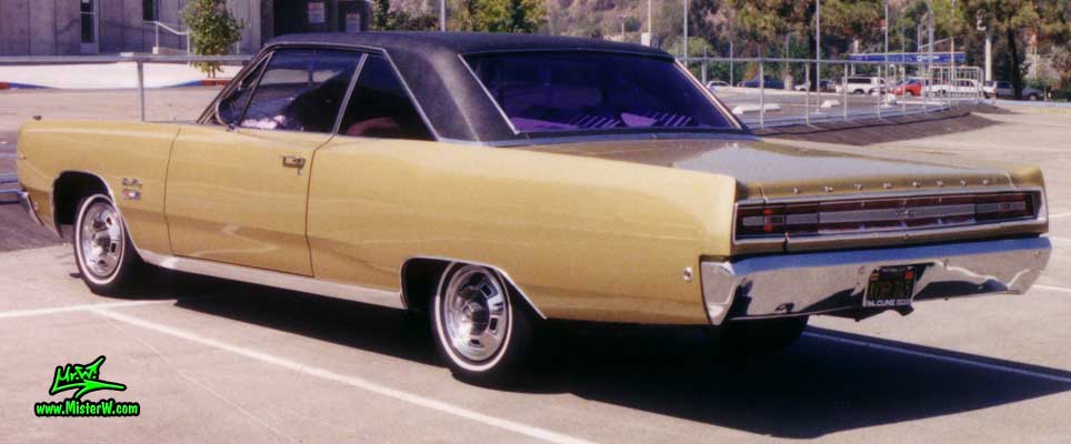 Photo of a gold brown 1968 Chrysler Plymouth Sport Fury 2 Door Hardtop Coupe at the San Diego Auto Swap & Show at the Qualcomm Stadium. Rearview of a 1968 Plymouth Sport Fury Coupe