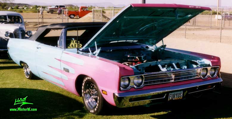Photo of a blue 1969 Chrysler Plymouth Convertible at a classic car show in Phoenix, Arizona. Frontview of a 1969 Plymouth Convertible
