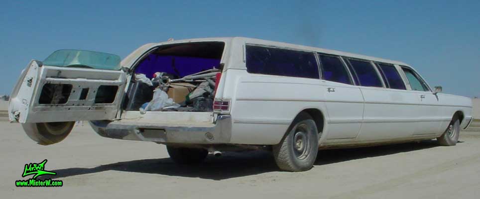 Photo of a white 1969 Chrysler Plymouth Strech Limo Wagon at the Burning Man Festival in Black Rock City, Nevada. Extra Long 1969 Plymouth Stationwagon