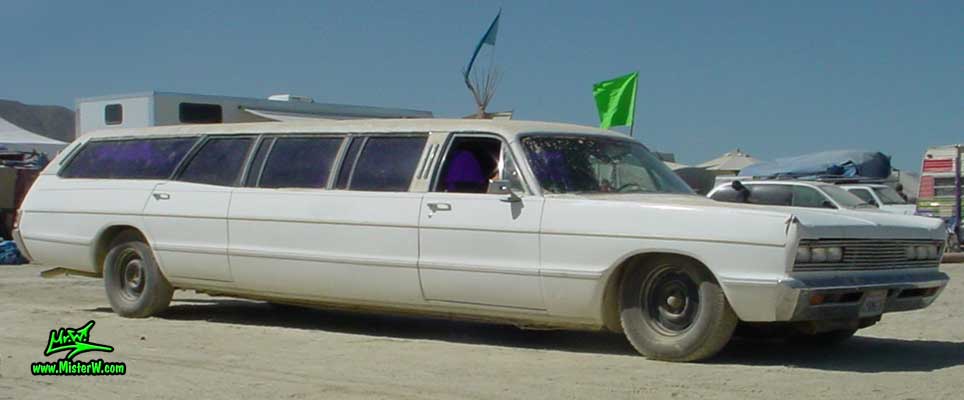 Photo of a white 1969 Chrysler Plymouth Strech Limo Wagon at the Burning Man Festival in Black Rock City, Nevada. 1969 Plymouth Stretch Wagon