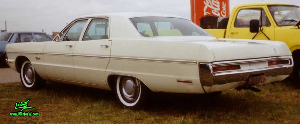 Photo of a white 1970 Chrysler Plymouth 4 Door Hardtop Sedan at a classic car meeting in Germany. Rearview of a 1970 Plymouth Sedan