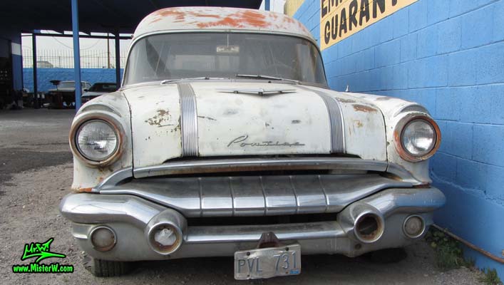Photo of a grey primered 1956 Pontiac ambulance in Phoenix, Arizona. Front chrome grill of a 56 Pontiac Ambulance Wagon