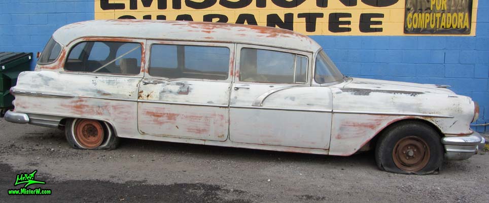 Photo of a grey primered 1956 Pontiac ambulance in Phoenix, Arizona. Side view of a 56 Pontiac Ambulance Wagon