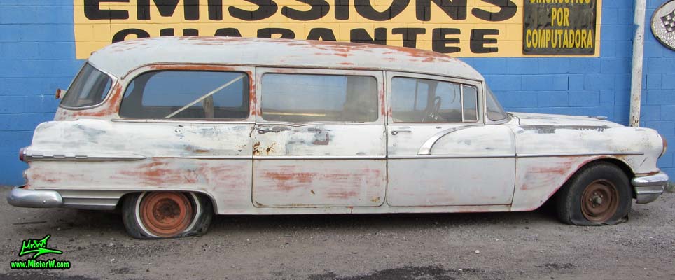 Photo of a grey primered 1956 Pontiac ambulance in Phoenix, Arizona. Side lines of a 56 Pontiac Ambulance Wagon