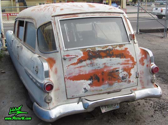 Photo of a grey primered 1956 Pontiac ambulance in Phoenix, Arizona. Rear door of a 56 Pontiac Ambulance Wagon