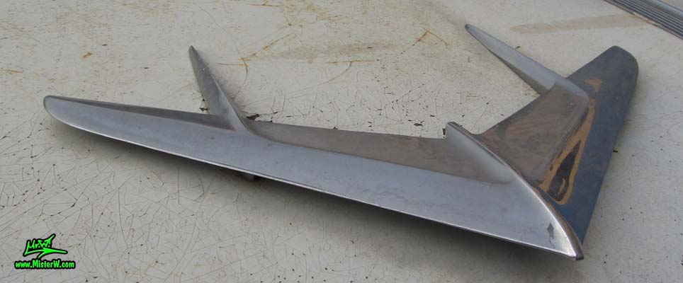 Photo of a grey primered 1956 Pontiac ambulance in Phoenix, Arizona. Chrome hood ornament of a 56 Pontiac Ambulance Wagon