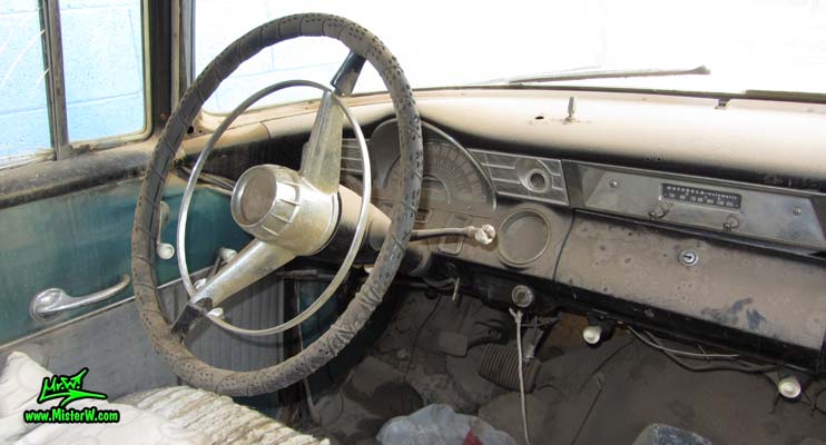 Photo of a grey primered 1956 Pontiac ambulance in Phoenix, Arizona. Speedometer of a 56 Pontiac Ambulance Wagon