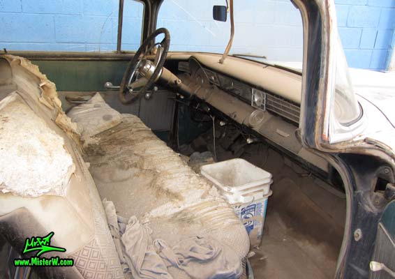 Photo of a grey primered 1956 Pontiac ambulance in Phoenix, Arizona. Front seat bench of a 56 Pontiac Ambulance Wagon