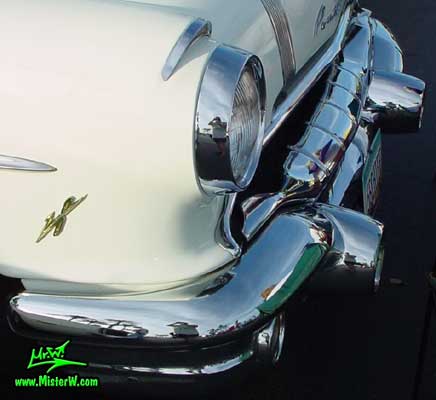 Photo of a jade & white 1956 Pontiac 2 Door Hardtop Coupe at the Scottsdale Pavilions Classic Car Show in Arizona. 1956 Pontiac Head Light & Chrome