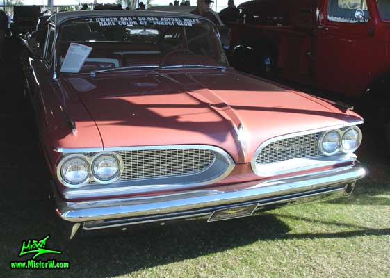 Photo of a pink 1959 Pontiac Star Chief 2 Door Hardtop Coupe at a Classic Car Auction in Scottsdale, Arizona. 1959 Pontiac Star Chief Frontview
