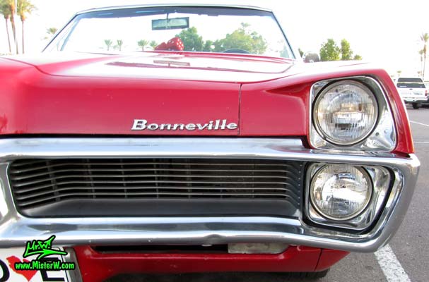 Photo of a red 1967 Pontiac Bonneville Convertible at the Scottsdale Pavilions Classic Car Show in Arizona. 1967 Pontiac Bonneville Convertible Front Grill