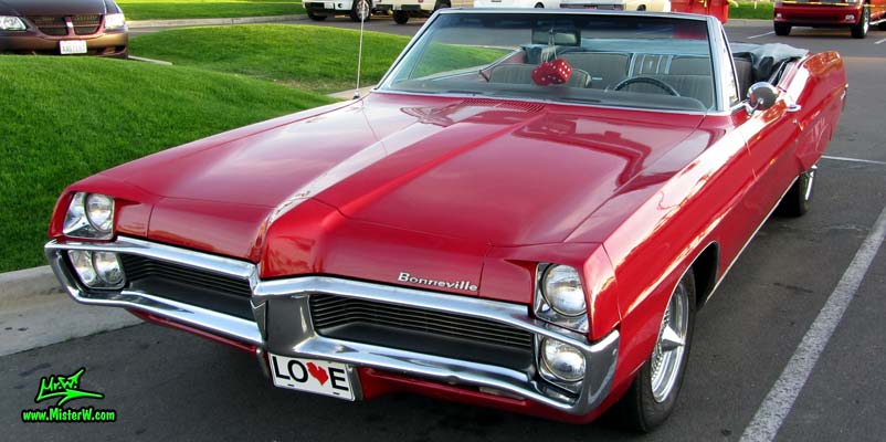 Photo of a red 1967 Pontiac Bonneville Convertible at the Scottsdale Pavilions Classic Car Show in Arizona. Agressive 67 Pontiac Bonneville Convertible Front Bumper