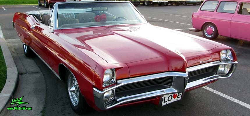 Photo of a red 1967 Pontiac Bonneville Convertible at the Scottsdale Pavilions Classic Car Show in Arizona. 1967 Pontiac Bonneville Cabrio