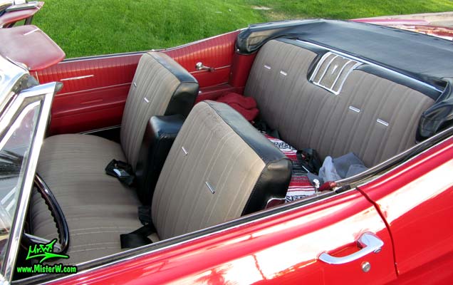 Photo of a red 1967 Pontiac Bonneville Convertible at the Scottsdale Pavilions Classic Car Show in Arizona. Interior of a 67 Pontiac Bonneville Convertible