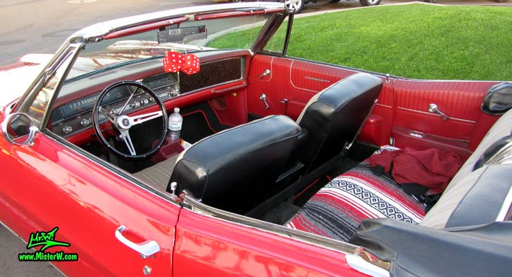 Photo of a red 1967 Pontiac Bonneville Convertible at the Scottsdale Pavilions Classic Car Show in Arizona. 1967 Pontiac Bonneville Convertible With Top Down