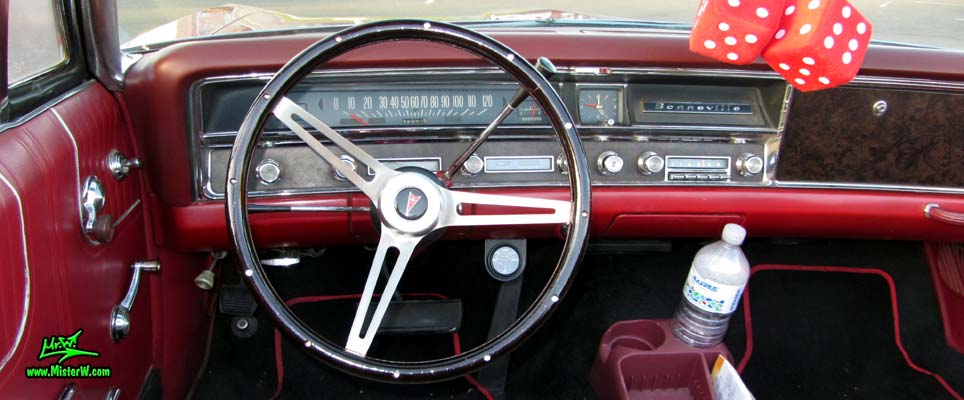 Photo of a red 1967 Pontiac Bonneville Convertible at the Scottsdale Pavilions Classic Car Show in Arizona. 1967 Pontiac Bonneville Convertible Odometer