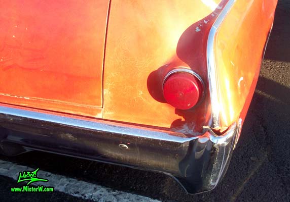 Photo of a red & white 1968 Pontiac Bonneville Ambulance at the Scottsdale Pavilions Classic Car Show in Arizona. Tail Light of a 68 Pontiac Bonneville Ambulance