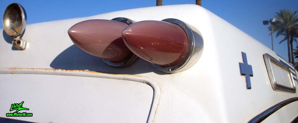 Photo of a red & white 1968 Pontiac Bonneville Ambulance at the Scottsdale Pavilions Classic Car Show in Arizona. Bullet Shaped Emergency Lights of a 68 Pontiac Bonneville Ambulance